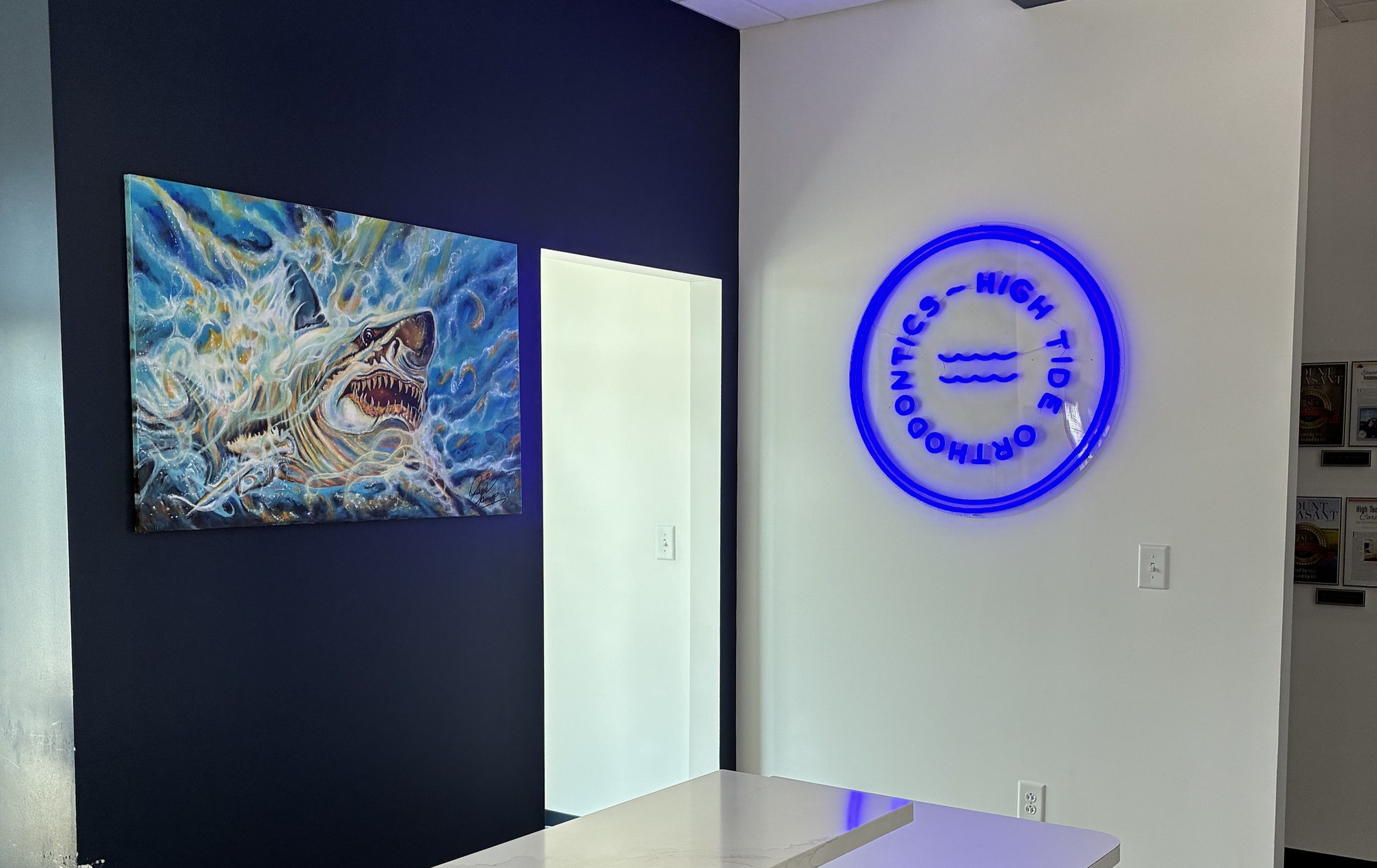 Shark painting by Daniel Samp installed in an orthodontics office lobby